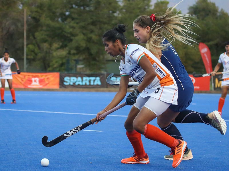 Indias Ishika Chaudhary carries the ball forward during her teams fifth match of Tour of Chile