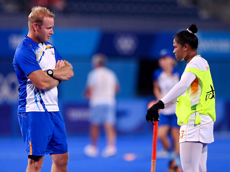 Indian Womens Hockey Chief Coach Sjoerd Marijne speaks to Deep Grace Ekka ahead of a match