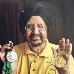 Gurbux with his Olympic Gold and Bronze medals