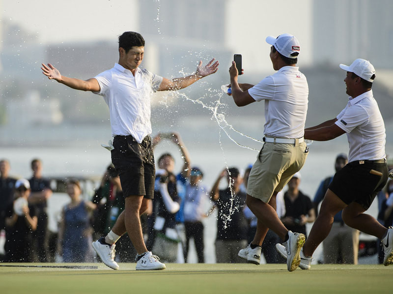 World No1 Keita Nakajima celebrates his win as his teammates rush to greet him at the Dubai Creek at the end of the Asia Paific Amateur Championship