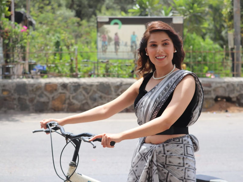 Sonam Arora rides a cycle wearing a saree