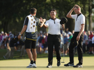 Si Woo Kim and Cam Davis celebrate their win in the Presidents Cup