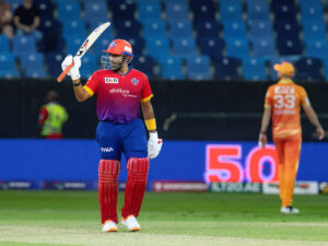 Robin Uthappa of Dubai Capitals raises his bat