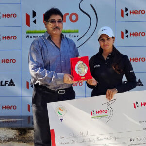 Seher Atwal receiving winners trophy and cheque