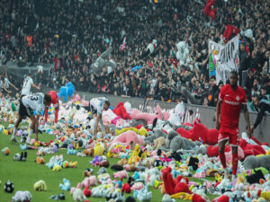 besiktas fans throw soft toys on to the pitch for children affected by earthquakes in turkey