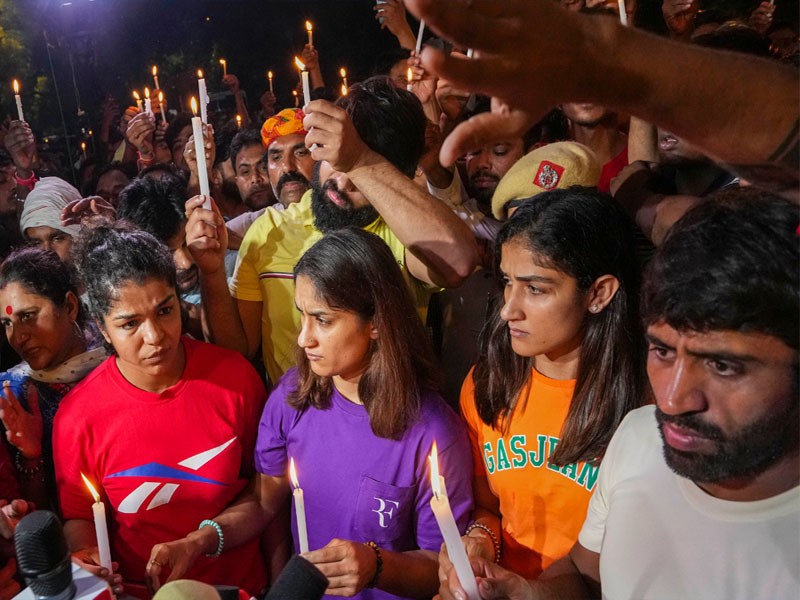 wrestlers protest candle march