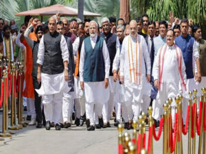 pm modi leads mps into new house